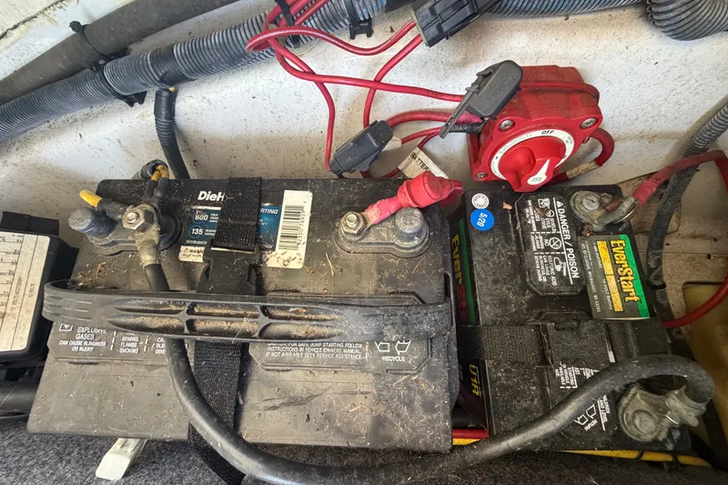 Slide: The Image of Battery setup in a 2016 Scarab 165 boat with wiring and switch. - 50