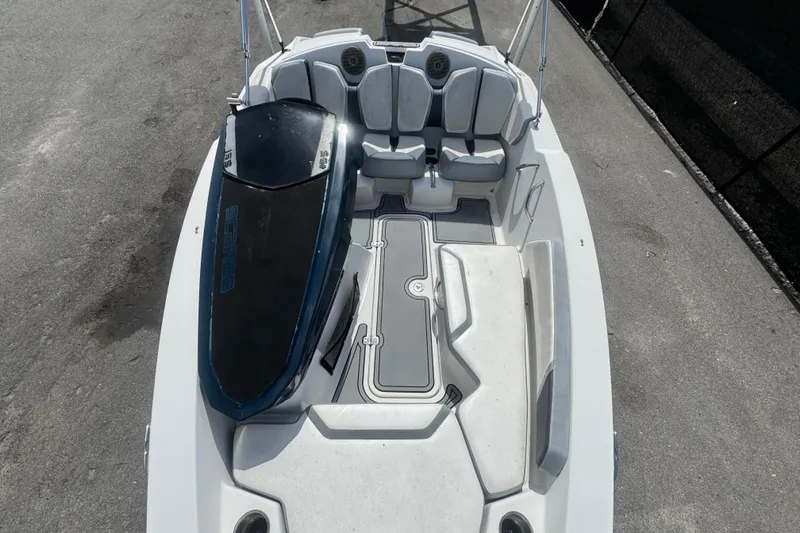 Slide: The Image of 2016 Scarab 165 boat interior with seating and a wakeboard on deck. - 35