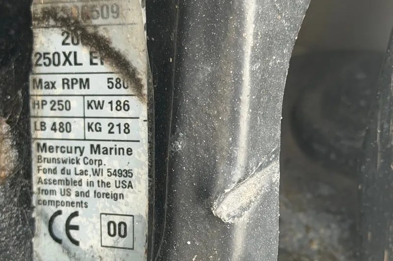 Slide: The Image of Label on Mercury Marine engine, showing specifications and assembly details. - 75