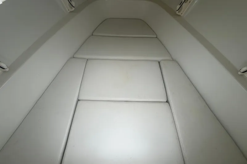 Slide: The Image of 2001 Baja 340 Islander Outboard cabin interior with cushioned seating. - 42