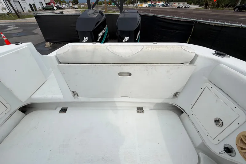 Slide: The Image of 2001 Baja 340 Islander Outboard boat interior with dual Mercury engines. - 65