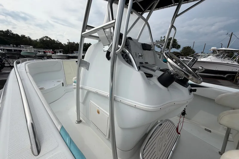 Slide: The Image of 2001 Baja 340 Islander Outboard boat interior with steering console and seating area. - 31