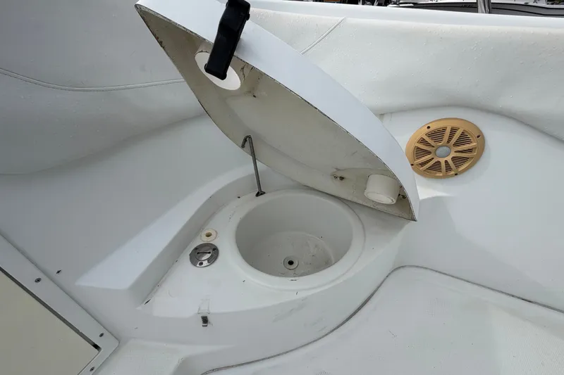 Slide: The Image of Open storage compartment on 2001 Baja 340 Islander Outboard boat with speaker detail. - 39