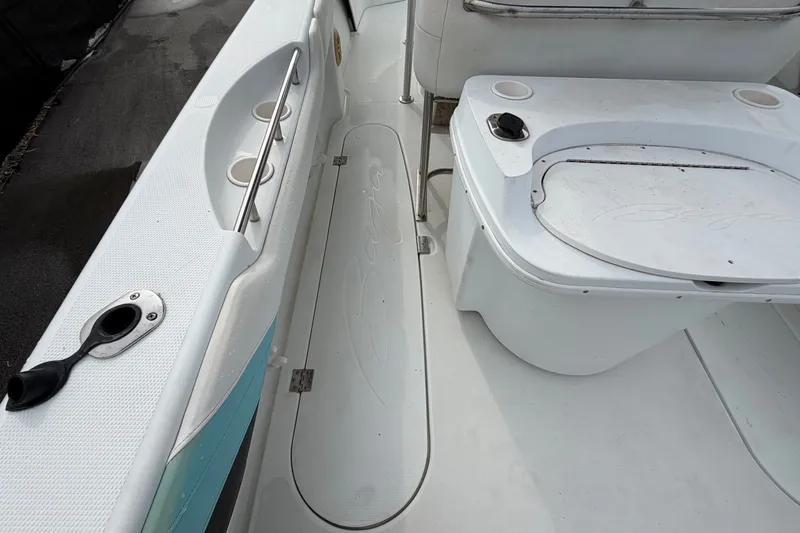 Slide: The Image of 2001 Baja 340 Islander Outboard boat deck with seating and storage compartments. - 21
