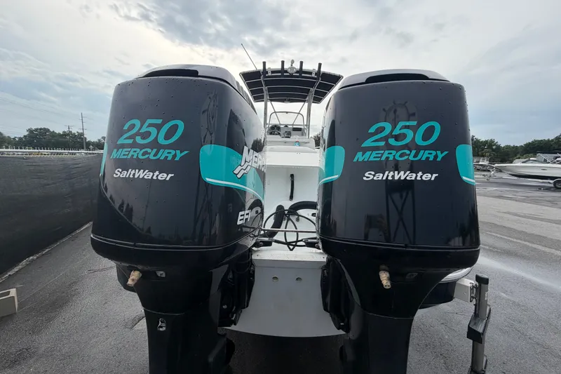 Slide: The Image of Twin Mercury 250 Saltwater outboard engines on a 2001 Baja 340 Islander boat. - 3
