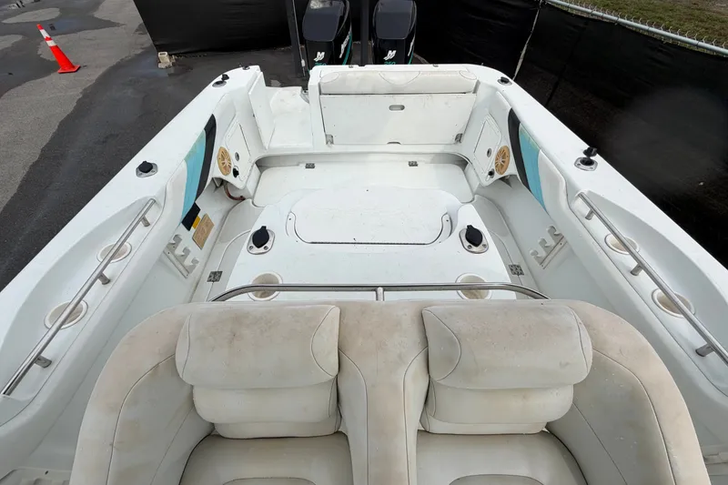 Slide: The Image of 2001 Baja 340 Islander Outboard boat interior with seating and storage compartments. - 57