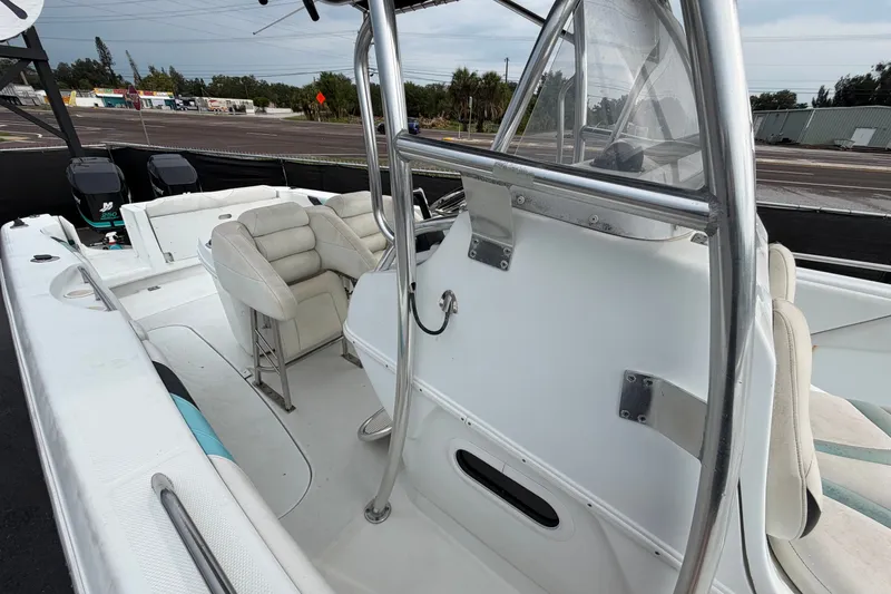 Slide: The Image of 2001 Baja 340 Islander Outboard boat interior with seating and dual engines. - 52