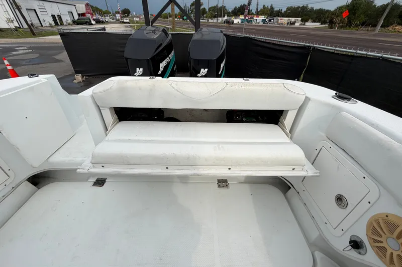 Slide: The Image of 2001 Baja 340 Islander Outboard boat interior with seating and dual Mercury engines. - 66