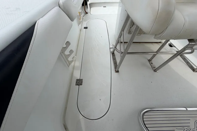 Slide: The Image of 2001 Baja 340 Islander Outboard interior with white seating and stainless steel fixtures. - 55