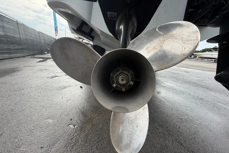 Slide: The Image of Close-up of a 2001 Baja 340 Islander Outboard propeller on wet pavement. - 7