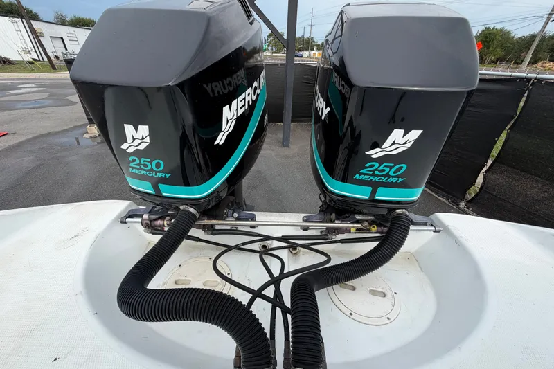 Slide: The Image of Twin Mercury 250 outboard engines on a 2001 Baja 340 Islander boat. - 73