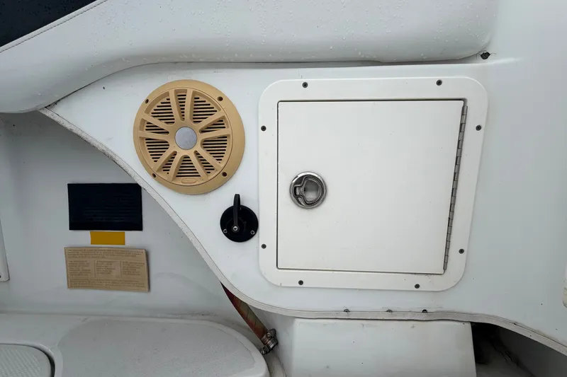 Slide: The Image of 2001 Baja 340 Islander Outboard boat interior with speaker and storage compartment. - 59