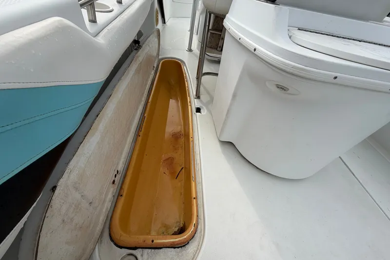 Slide: The Image of 2001 Baja 340 Islander Outboard boat interior with storage compartment and seating. - 22