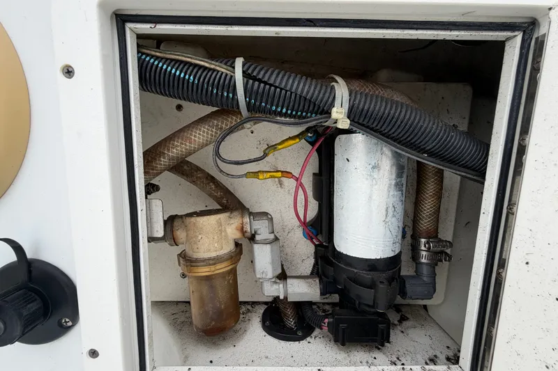 Slide: The Image of 2001 Baja 340 Islander Outboard engine compartment with hoses and wiring. - 60
