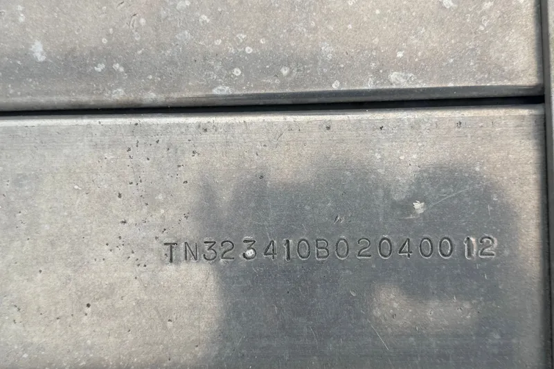 Slide: The Image of Serial number engraved on metal surface of 2001 Baja 340 Islander Outboard. - 77