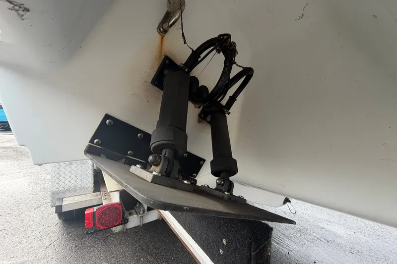 Slide: The Image of 2001 Baja 340 Islander Outboard trim tabs and hydraulic system on trailer. - 8