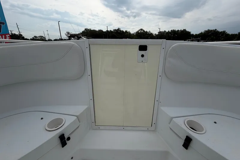 Slide: The Image of 2001 Baja 340 Islander Outboard boat interior with seating and cup holders. - 40