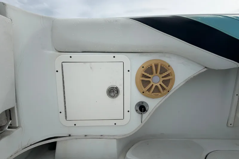 Slide: The Image of 2001 Baja 340 Islander Outboard boat interior with speaker and storage compartment. - 68