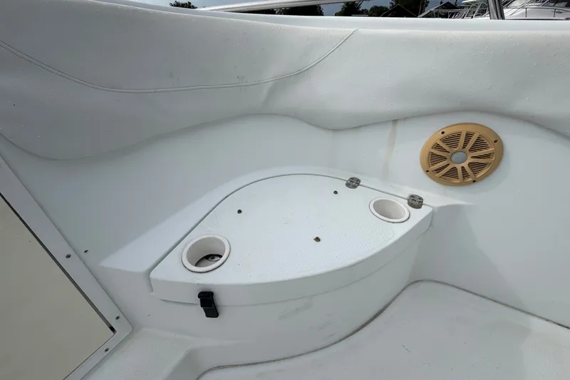 Slide: The Image of 2001 Baja 340 Islander Outboard boat interior with cup holders and speaker. - 38