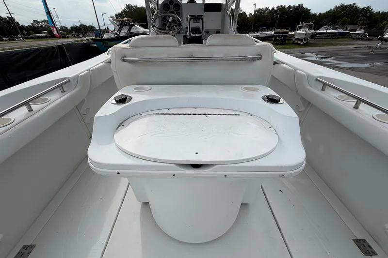 Slide: The Image of 2001 Baja 340 Islander Outboard boat interior with seating and storage area. - 18