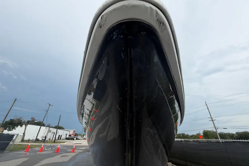 Slide: The Image of 2001 Baja 340 Islander Outboard boat viewed from the front, parked on a street. - 12