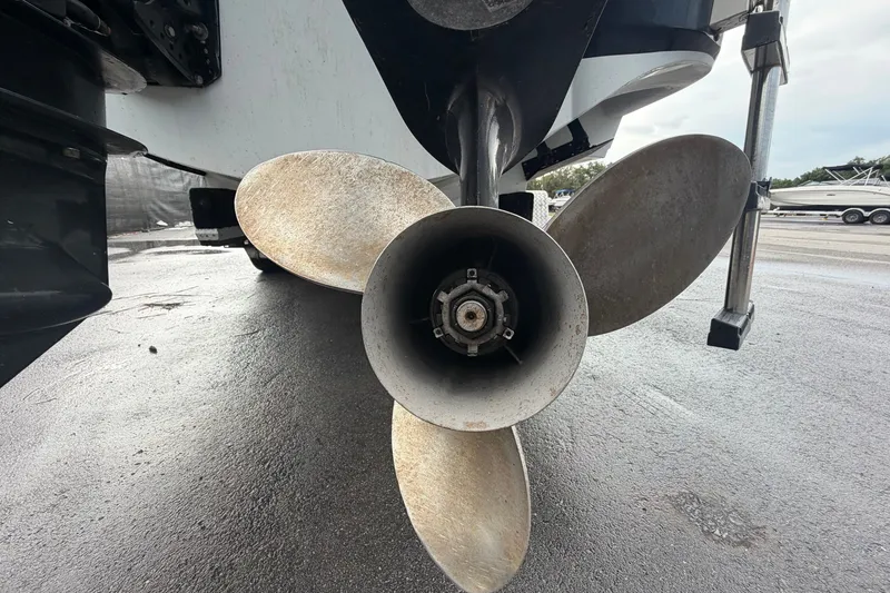 Slide: The Image of Propeller of a 2001 Baja 340 Islander Outboard boat on a wet surface. - 6