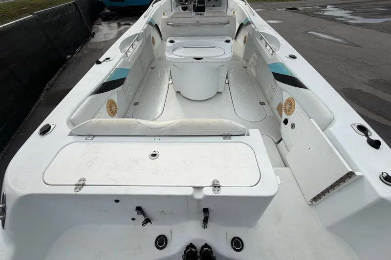 Slide: The Image of 2001 Baja 340 Islander Outboard boat interior with seating and storage compartments. - 15