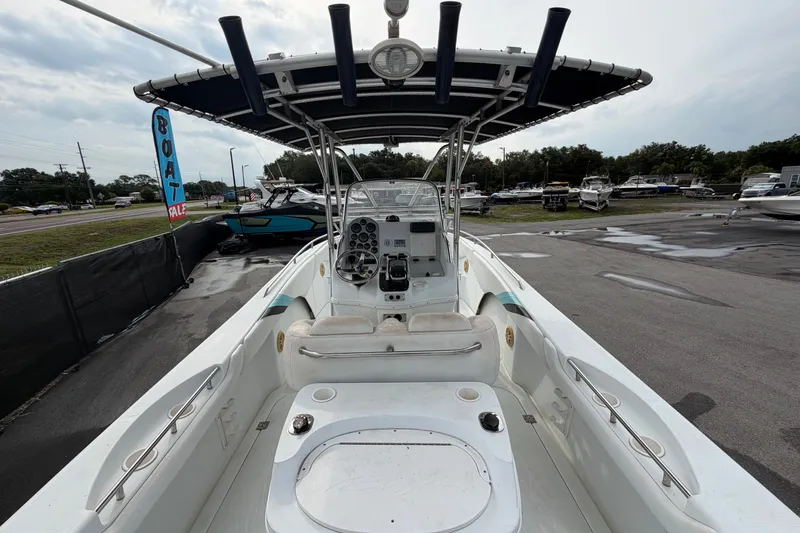 Slide: The Image of 2001 Baja 340 Islander Outboard boat interior with steering console and seating, displayed for sale. - 17