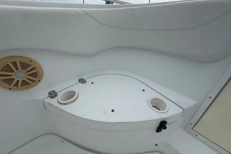 Slide: The Image of 2001 Baja 340 Islander Outboard boat interior with cup holders and speaker. - 36