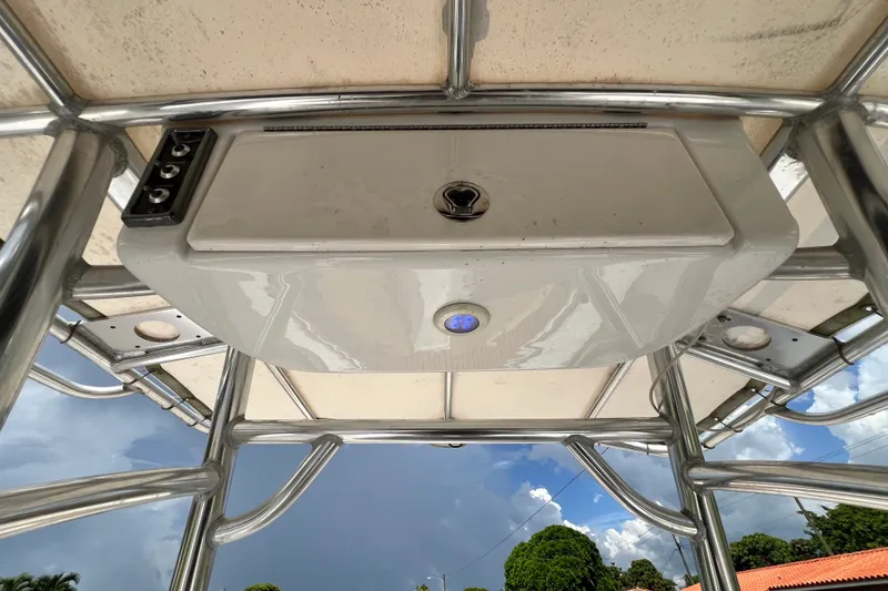 Slide: The Image of 2016 Sportsman Heritage 231 Center Console boat's overhead console and T-top structure. - 27