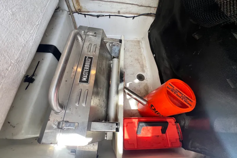 Slide: The Image of Storage area on a 2016 Sportsman Heritage 231 Center Console with Masterbuilt equipment. - 30