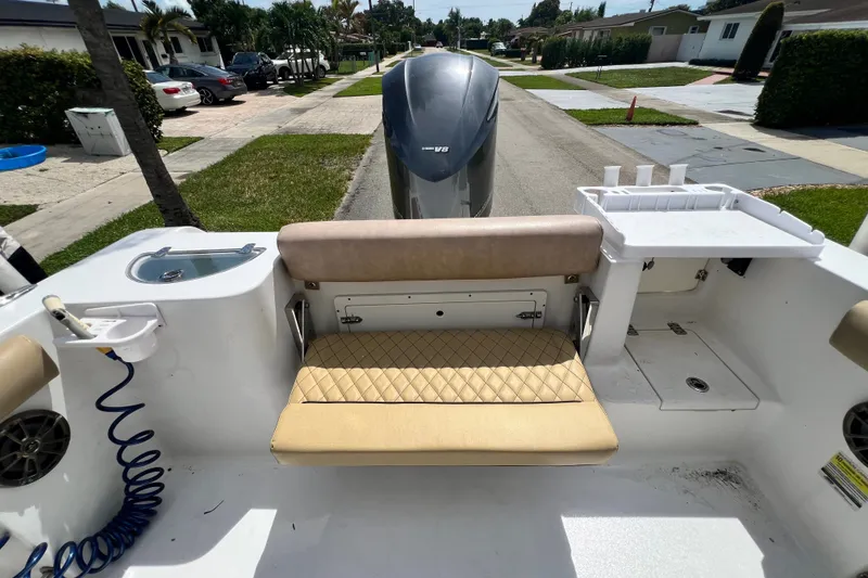 Slide: The Image of 2016 Sportsman Heritage 231 Center Console boat interior with seating and storage. - 47