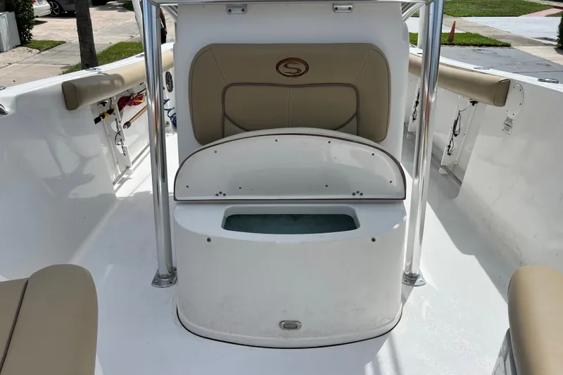 Slide: The Image of 2016 Sportsman Heritage 231 Center Console boat interior with seating and storage compartment. - 42
