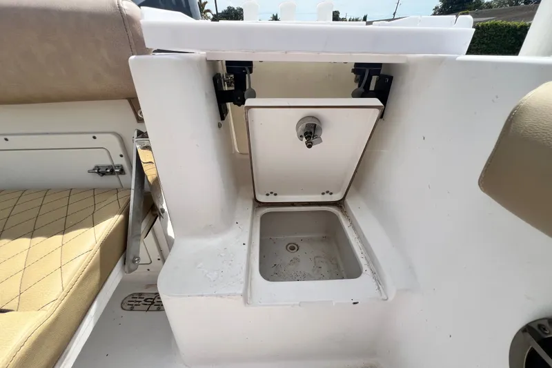 Slide: The Image of 2016 Sportsman Heritage 231 Center Console boat interior storage compartment. - 50