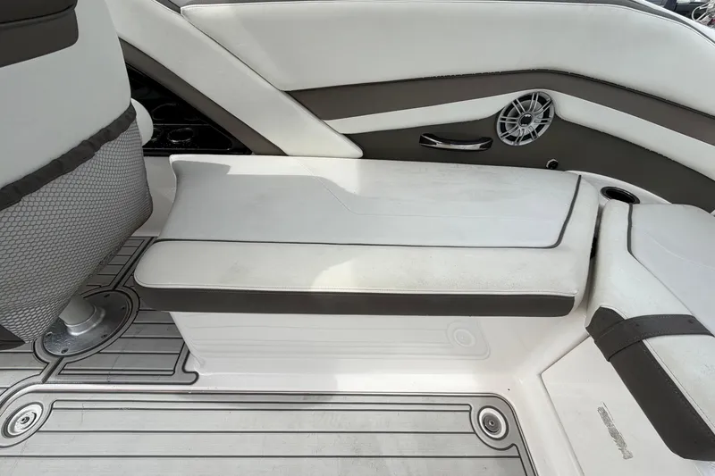 Slide: The Image of 2016 Yamaha Boats 242 Limited S E-Series interior seating with speaker and cup holder. - 49