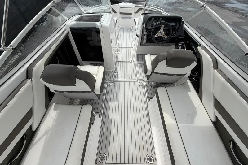 Slide: The Image of 2016 Yamaha Boats 242 Limited S E-Series interior with sleek seating and modern dashboard. - 16