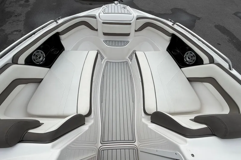 Slide: The Image of 2016 Yamaha Boats 242 Limited S E-Series interior with white seating and sleek design. - 30