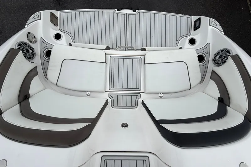 Slide: The Image of 2016 Yamaha Boats 242 Limited S E-Series interior seating with speakers and cup holders. - 62
