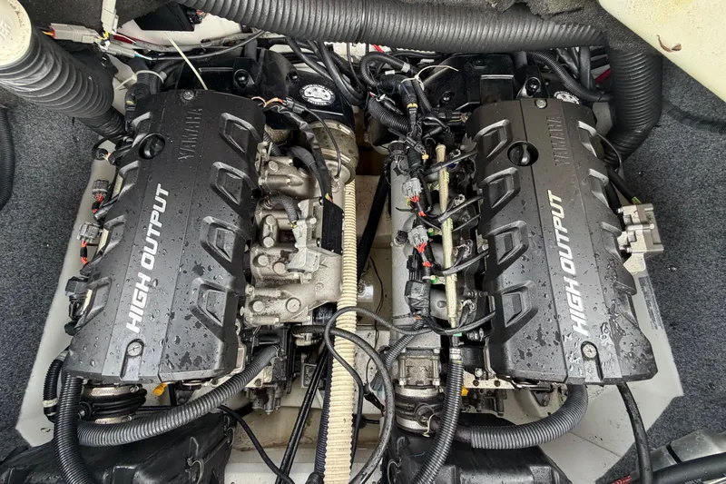 Slide: The Image of Twin high-output engines in a 2016 Yamaha Boats 242 Limited S E-Series. - 54