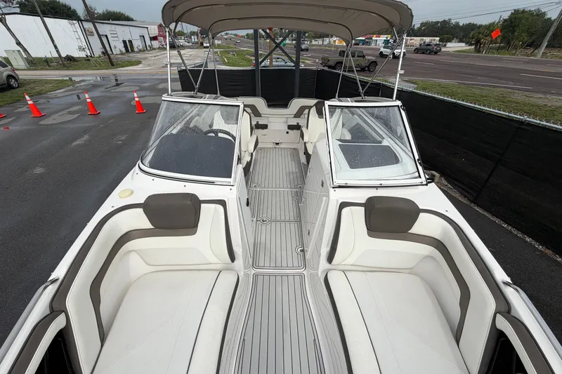 Slide: The Image of 2016 Yamaha Boats 242 Limited S E-Series interior with seating and canopy. - 38
