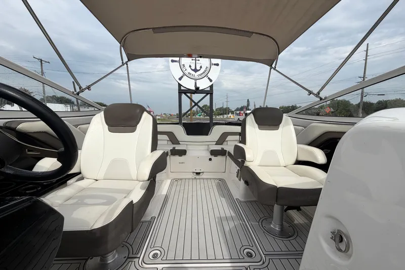 Slide: The Image of 2016 Yamaha Boats 242 Limited S E-Series interior with seating and canopy. - 40