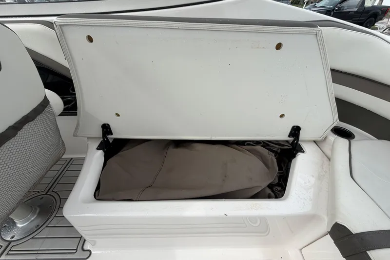 Slide: The Image of Open storage compartment on 2016 Yamaha Boats 242 Limited S E-Series, showcasing interior space. - 50