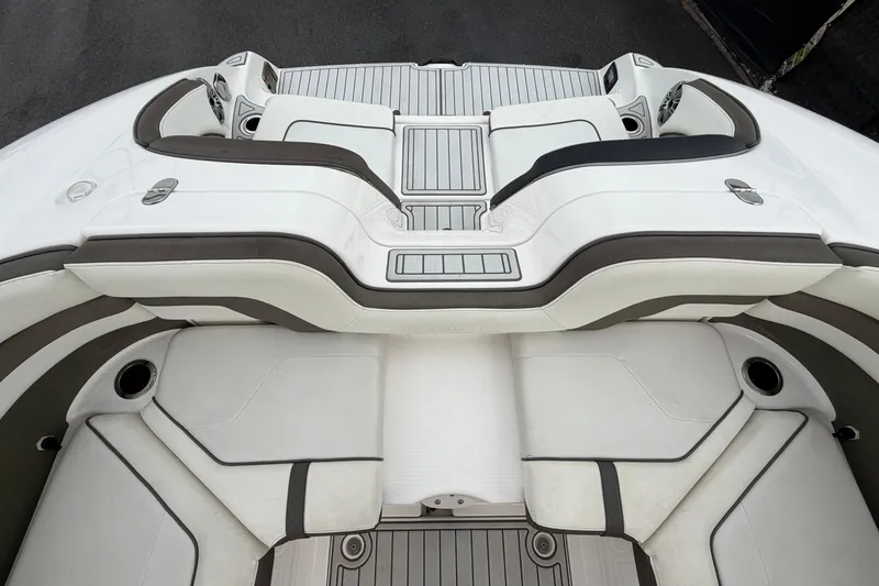 Slide: The Image of 2016 Yamaha Boats 242 Limited S E-Series interior seating, featuring sleek white and gray upholstery. - 60