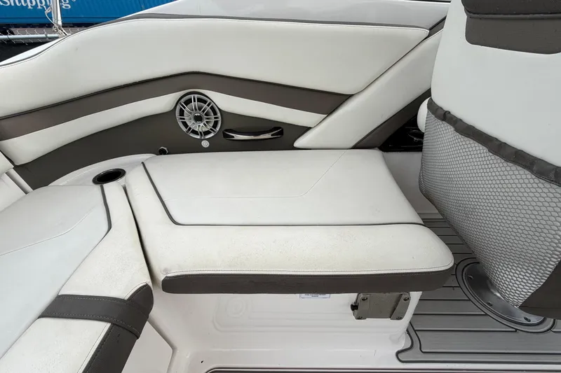 Slide: The Image of Interior seating of 2016 Yamaha Boats 242 Limited S E-Series, featuring sleek design and speaker system. - 55