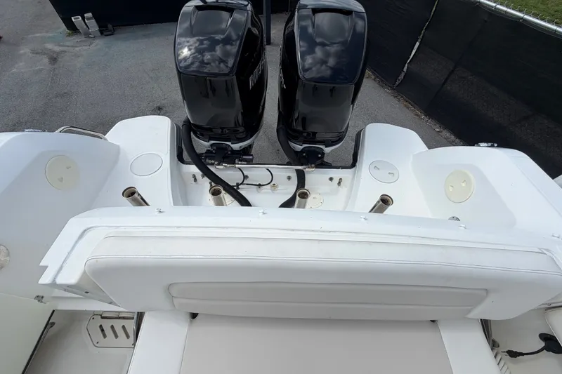 Slide: The Image of 2015 Boston Whaler 270 Vantage boat with dual outboard engines, rear seating view. - 74