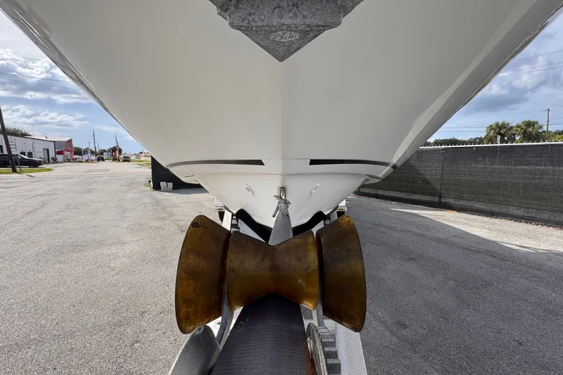 Slide: The Image of The underside of a 2015 Boston Whaler 270 Vantage on a trailer. - 16