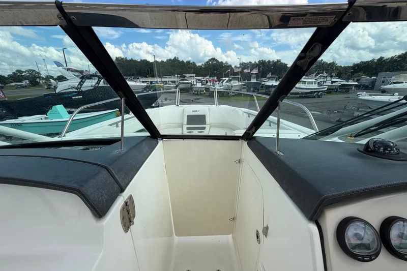 Slide: The Image of 2015 Boston Whaler 270 Vantage boat interior view with dashboard and windshield. - 48