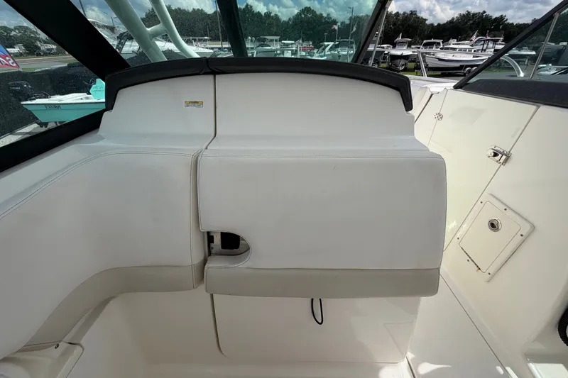 Slide: The Image of Interior view of a 2015 Boston Whaler 270 Vantage boat, showcasing seating and storage. - 28