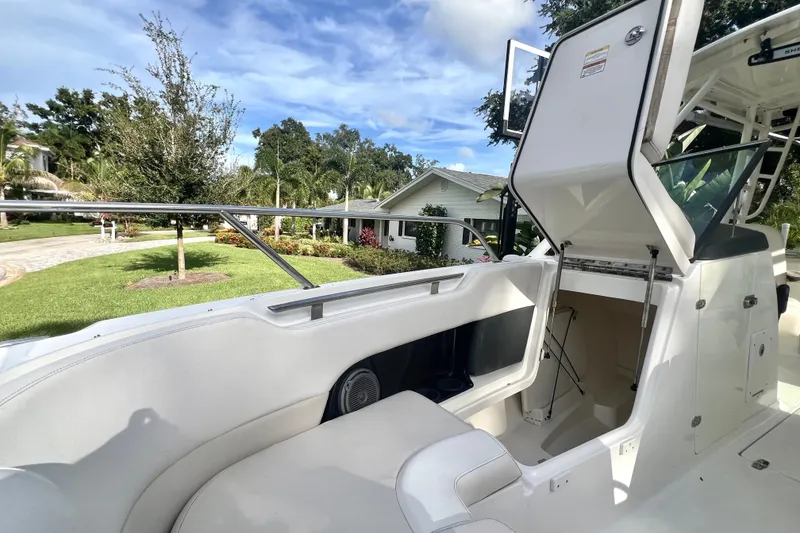 Slide: The Image of 2015 Boston Whaler 270 Vantage boat interior with open storage compartment. - 61