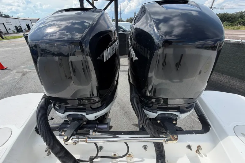Slide: The Image of Twin Mercury outboard engines on a 2015 Boston Whaler 270 Vantage boat. - 76